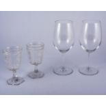 Six large wine glasses, by Riedel, and a set of six smaller cut glass wine goblets,