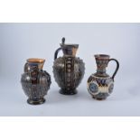 Doulton Lambeth, three stoneware jugs, two of similar design, graduated,