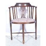 Stained beech hoop-back elbow chair, pierced back, upholstered seat, turned legs.