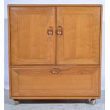 Ercol, a television cabinet, elm,