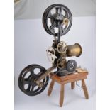 Early hand cranked silent movie projector, lacking lamp.