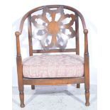 Edwardian stained beech hoop-back elbow chair, upholstered seats, turned legs joined by rails,