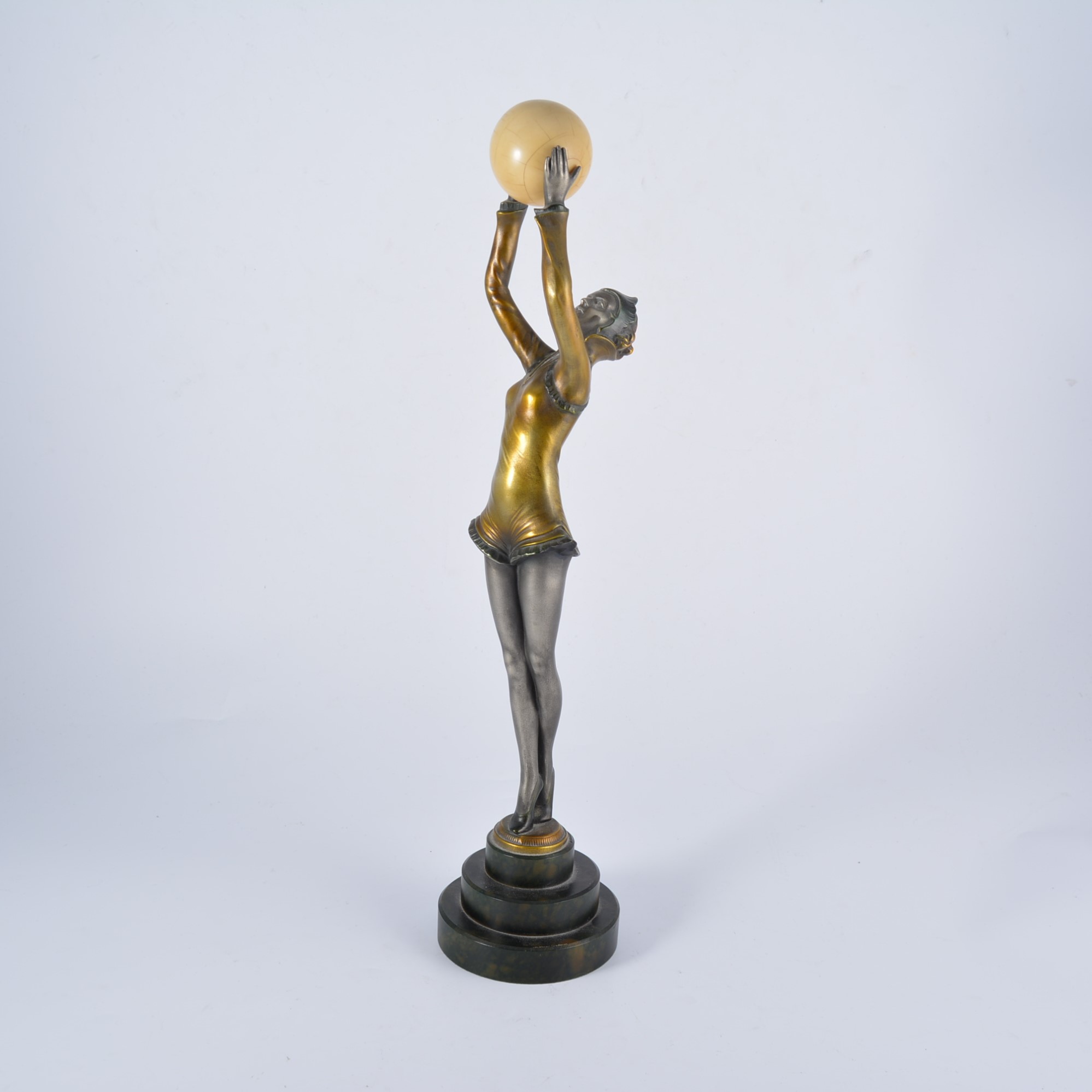 An Art Deco style figure of a dancing girl, late 20th century, patinated resin,