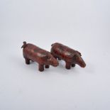 A pair of maroon leather pigs, stamped Valenti,