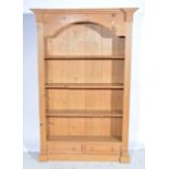 Modern pine open bookcase, three fixed shelves above two drawers,