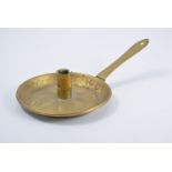 Victorian brass chamber stick, circular drip pan with stamped heart motifs, decorated handle, 29cm.