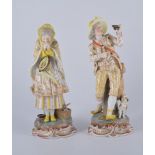 Pair of Continental porcelain figures, lady and gentlemen musicians in 18th Century dress,