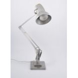 Herbert Terry & Sons, a polished steel angle poise lamp, circa 1925, stepped square section base.
