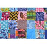 Patchwork quilt, patchwork worked on blue cloth.