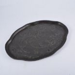 An Art Nouveau tray, chased and embossed pewter with Iris design,