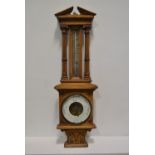 Oak aneroid barometer, with silvered thermometer, height 81cm.