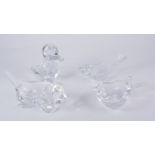 Four French crystal glass dishes, formed as a duck, cat, dolphin, and a pear, etched marks,