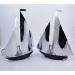European pair of chrome metal lamps in the form of yachts, the mast formed by tubular light bulb,