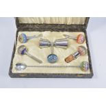 Cased set of drink requisites, including bottle openers, corkscrews, etc.