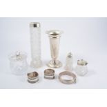 Silver pedestal vase, weighted base, cut-glass vase with silver mount, two silver napkin rings,