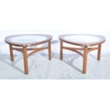 Pair of 1960s G-Plan style teak glass top tables, rounded triangular form,
