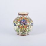 English Art Pottery faience vase, decorated with purple flower heads, encircled by leaves,
