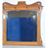 Large Art Nouveau style mirror, shaped and pierced oak frame,