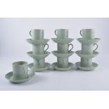 Wedgwood, a set of Orient Line coffee cans and saucers, pale green ground with monogram motif,