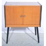 Homeworthy teak two-door record cabinet, ebonised and gilt outline,