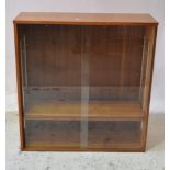 Teak glazed bookcase, pair of sliding glass doors, three shelves, W85cm x D31cm x H88cm.