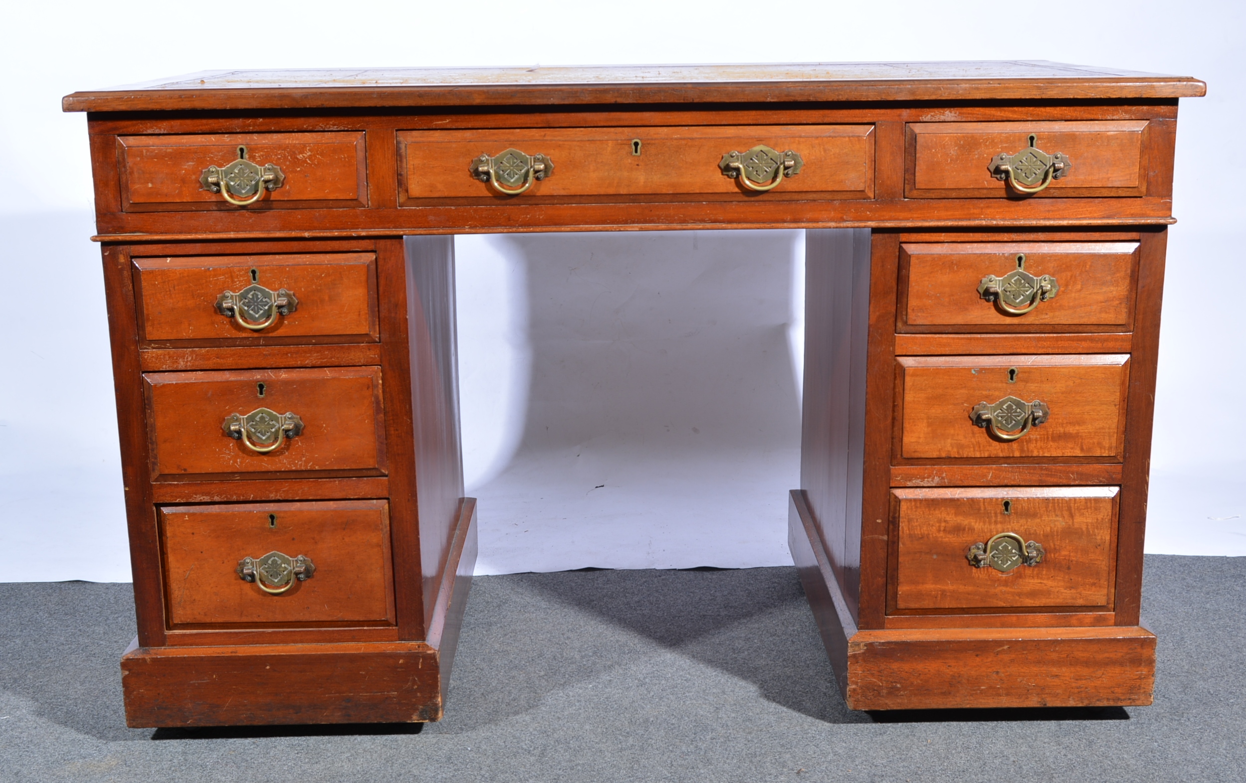 Edwardian walnut desk, rectangular top with a tooled and gilt leather inset,