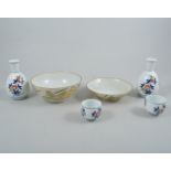 Japanese porcelain saki set and a set of bowls, both boxed.