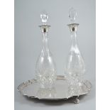 Pair of cut-glass decanters, with silver collars, Birmingham 1988,