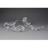 Four French crystal glass dishes, formed as a duck, cat, dolphin, and a pear, etched marks,