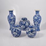 Three Chinese blue and white ginger jars, Prunus pattern; and a pair of similar vases 30cm.