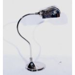 A modern nickel-plated desk lamp in the Art Deco style,