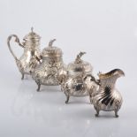 A continental white metal four piece tea set,