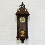 Vienna type wall clock, walnut and stained wood case, prancing horse pediment,