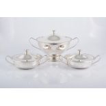 A set of three silver plated pedestal tureens, marked BMF, each with twin handles,