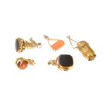 Five seal type charms, a 9 carat yellow gold horses head with black onyx to base,