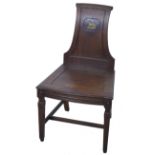 Regency style mahogany hall chair, 19th Century, panelled back with applied brass crest, solid seat,