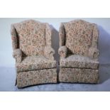 Two Parker Knoll wingback armchairs, one with retractable footrest.