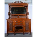 Victorian walnut sideboard, carved decoration, mirror back under a canopy, with carved panels,