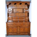 Reproduction oak dresser, moulded canopy, shaped apron, panelled back with drawers and shelves,