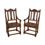 Pair of pine and walnut armchairs, carved crestings, solid seats, width 58cm.