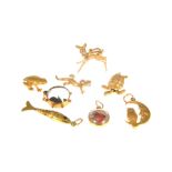 Eight 9 carat gold charms, an articulated fish, a frog, bambi, a tortoise, a lizard,