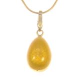 Faberge - an 18 carat yellow gold 20mm egg pendant, decorated with yellow guilloche enamel,