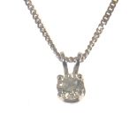 A diamond single stone pendant and chain, the brilliant cut stone,