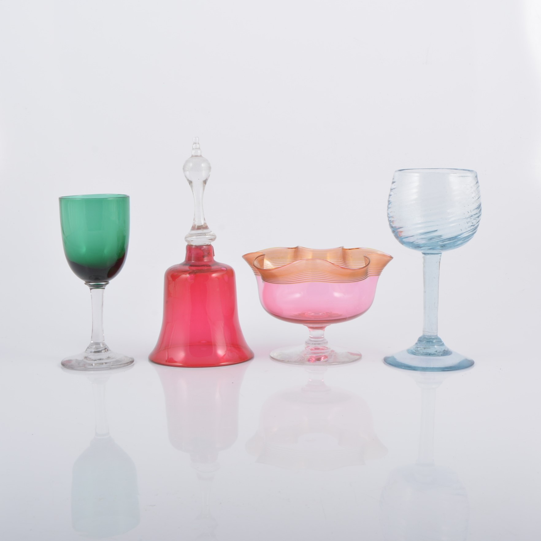 A collection of decorative and table glass, coloured wine glasses,