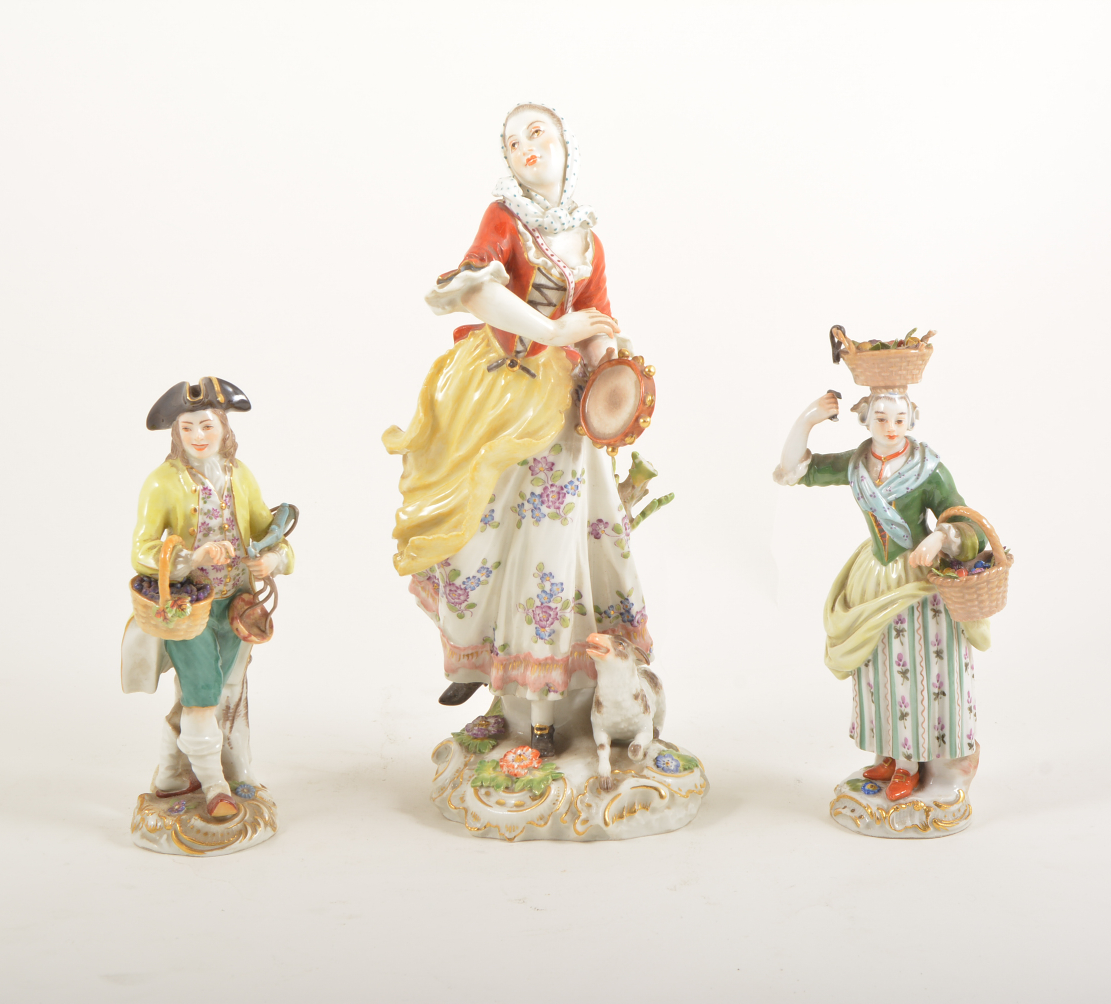 Three late Meissen figures, damaged,