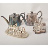 Two Britannia metal teapots; electroplated breakfast cruet; other condiments; cast rack, etc.