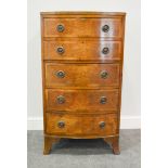 Walnut bow front chest of drawers, comprising five graduated drawers, bracket feet, W57.