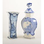 Delft jar, lozenge baluster form, the cover with a bird finial,height 35cm; four Delft vases,