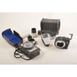 Camera accessories, including a Leitz bellows, Lunasix Gossen light meter,