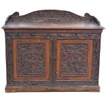 19th Century carved oak wall-mounted cupboard, carved with Chinese style dragon and lotus borders,